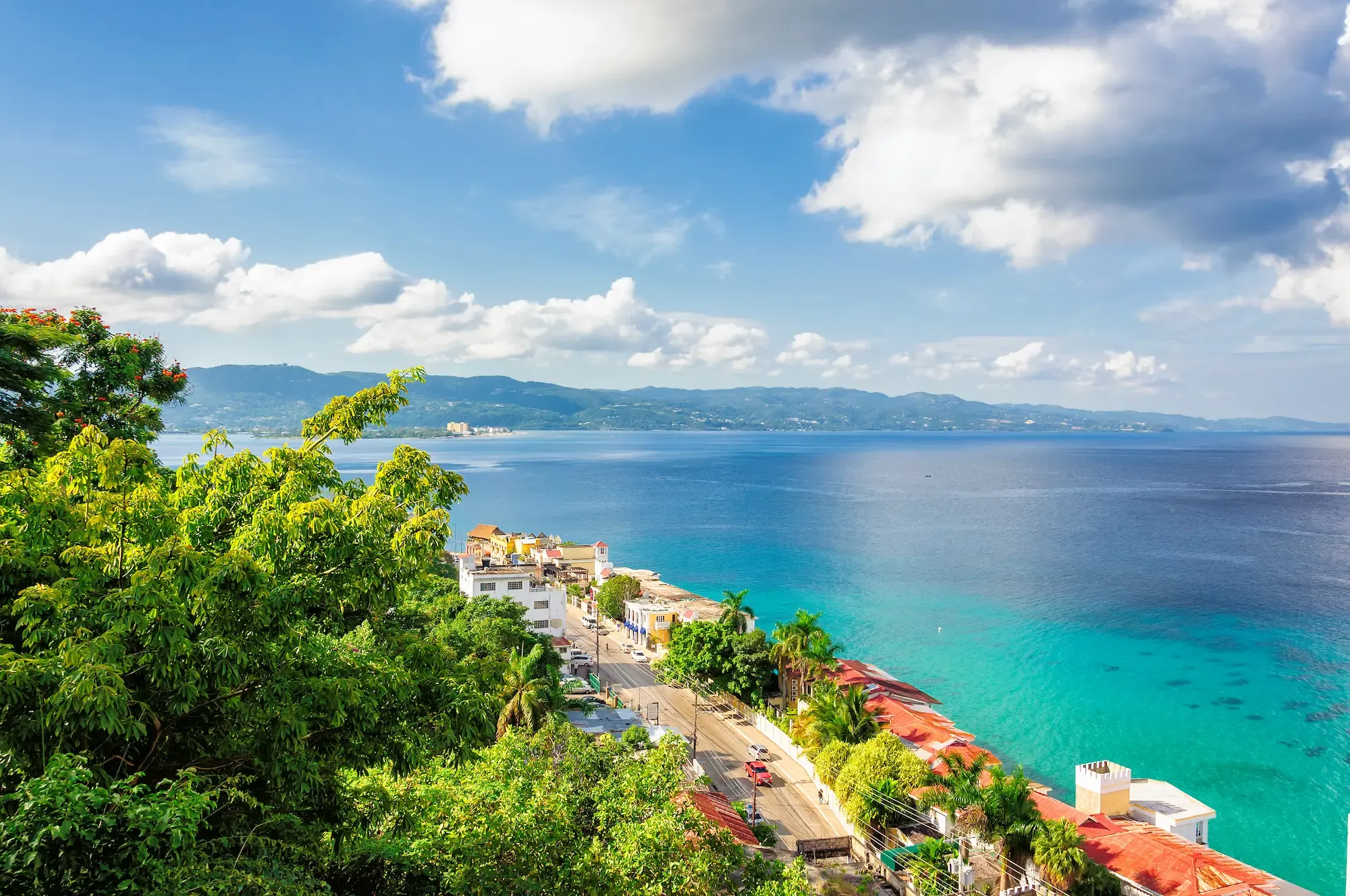 Montego Bay’s coastal road beside turquoise water
